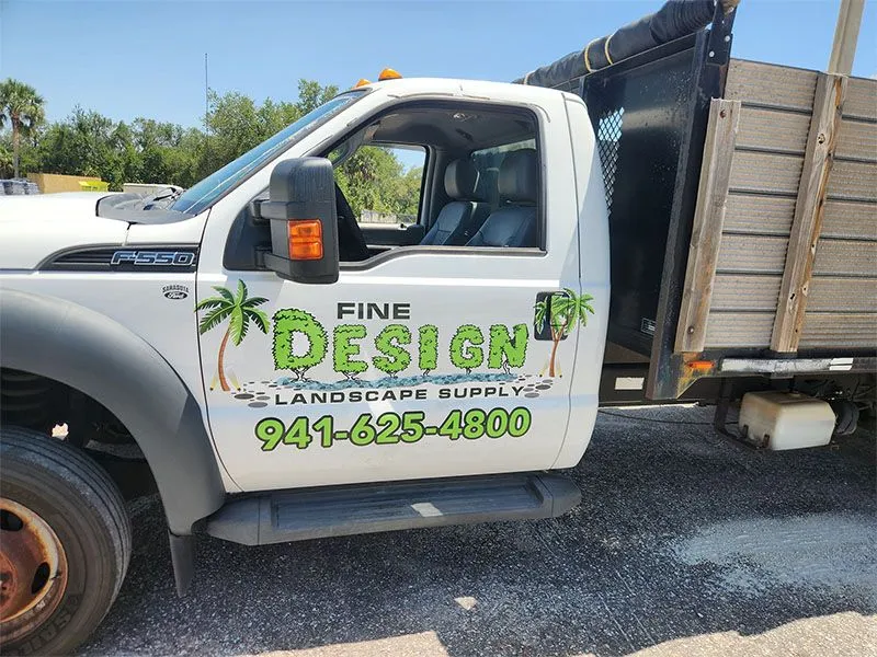 Fine Design Landscape Supply delivery truck loaded with materials