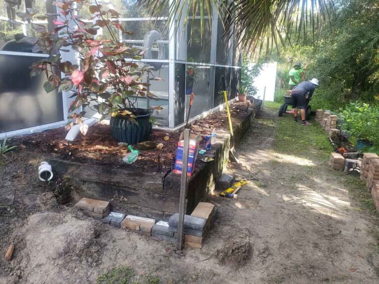 Fine Design employee performing landscaping services in port charlotte fl