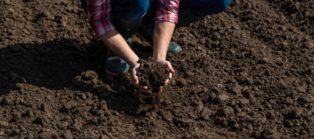 Topsoil being spread before installing a new lawn