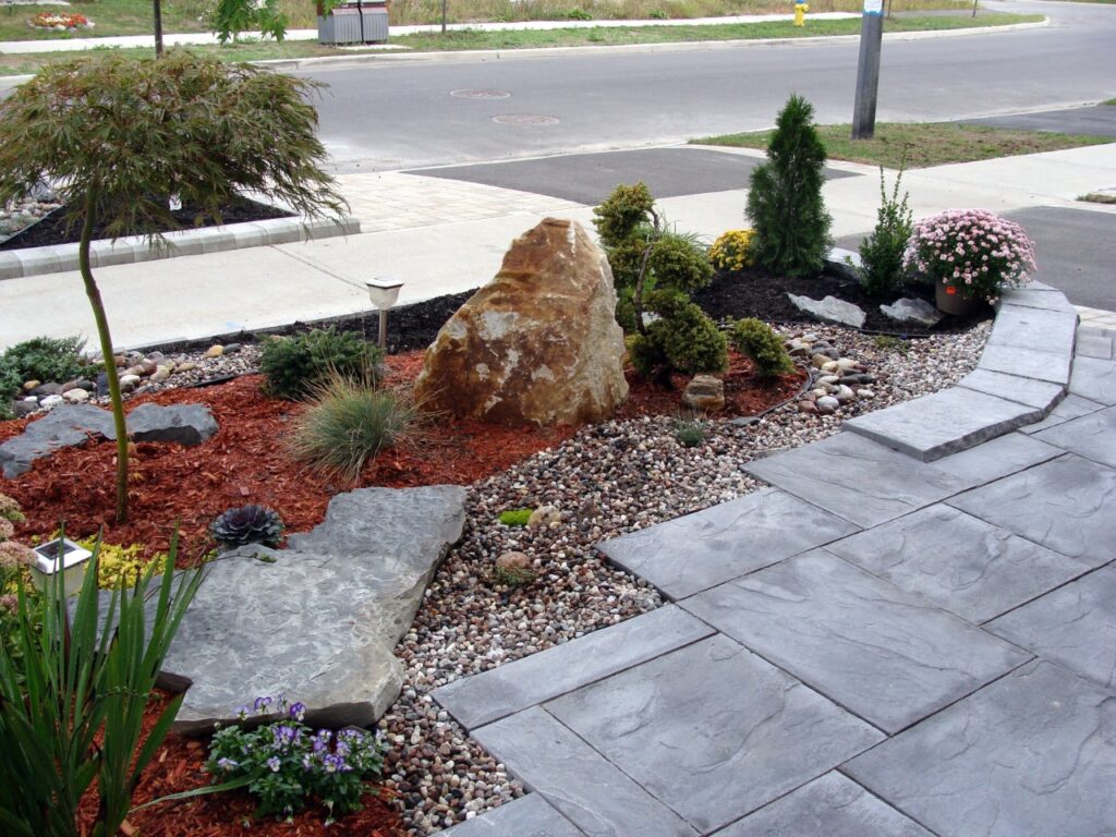 Landscape stone combined with plants in a Florida-friendly landscape