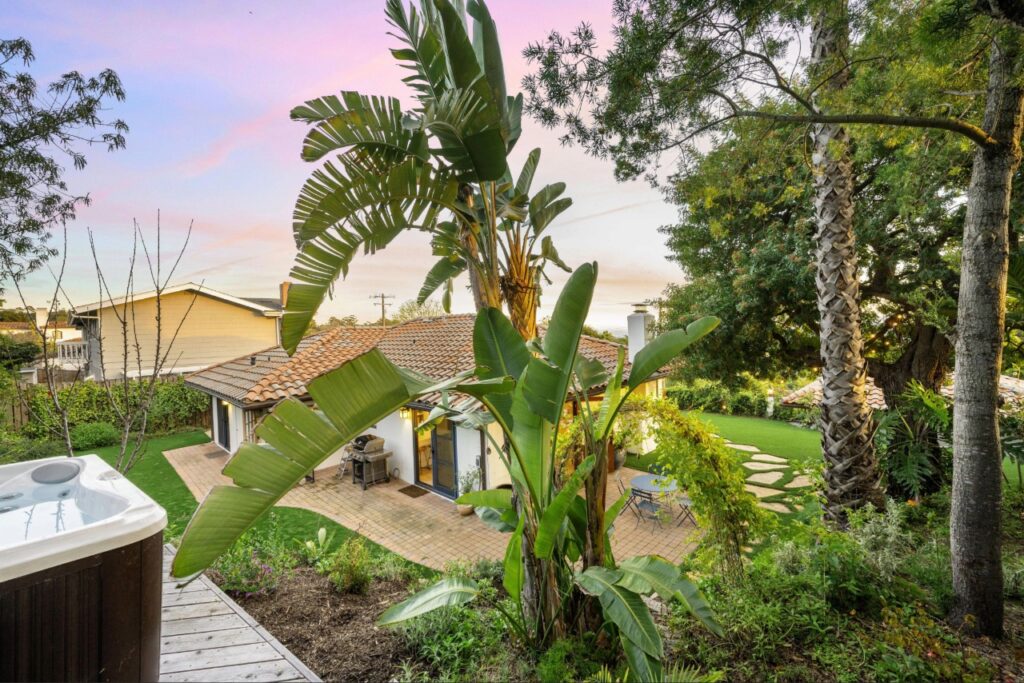 Dense landscaping near a Florida home that can provide pest shelter