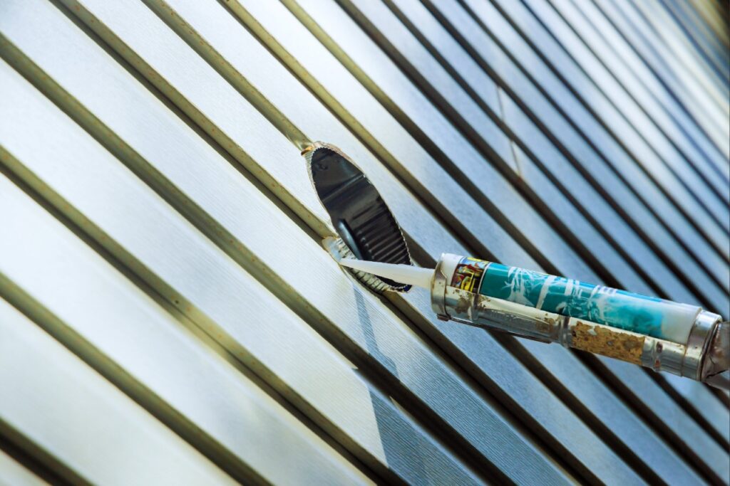 Sealing cracks around a home's exterior to help prevent cockroaches