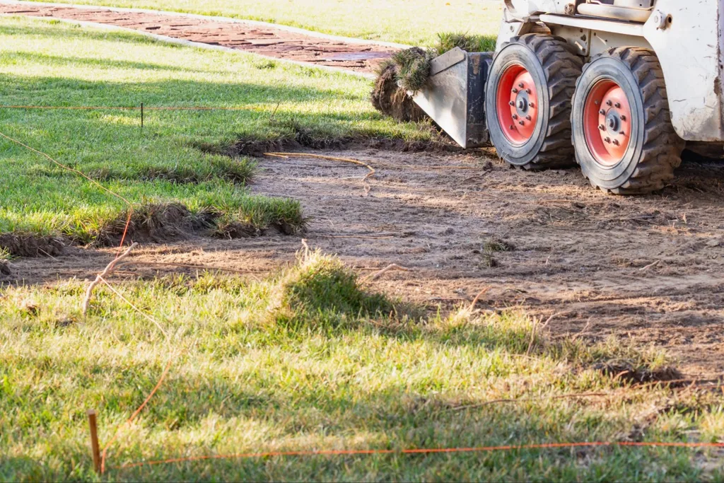 Old grass removal during sod soil preparation Port Charlotte project
