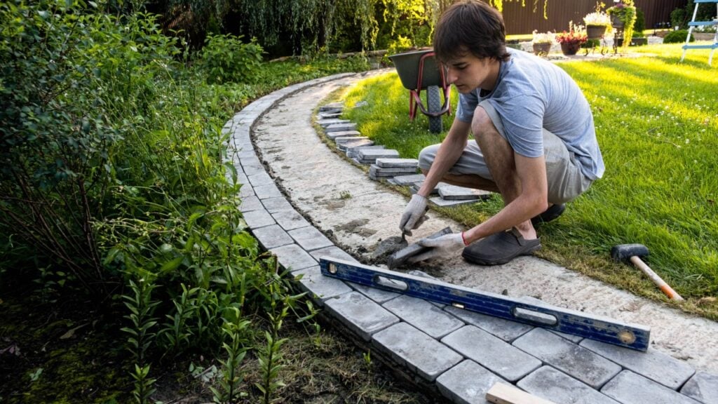 Concrete curbing Port Charlotte landscape bed with a curved border separating mulch and lawn