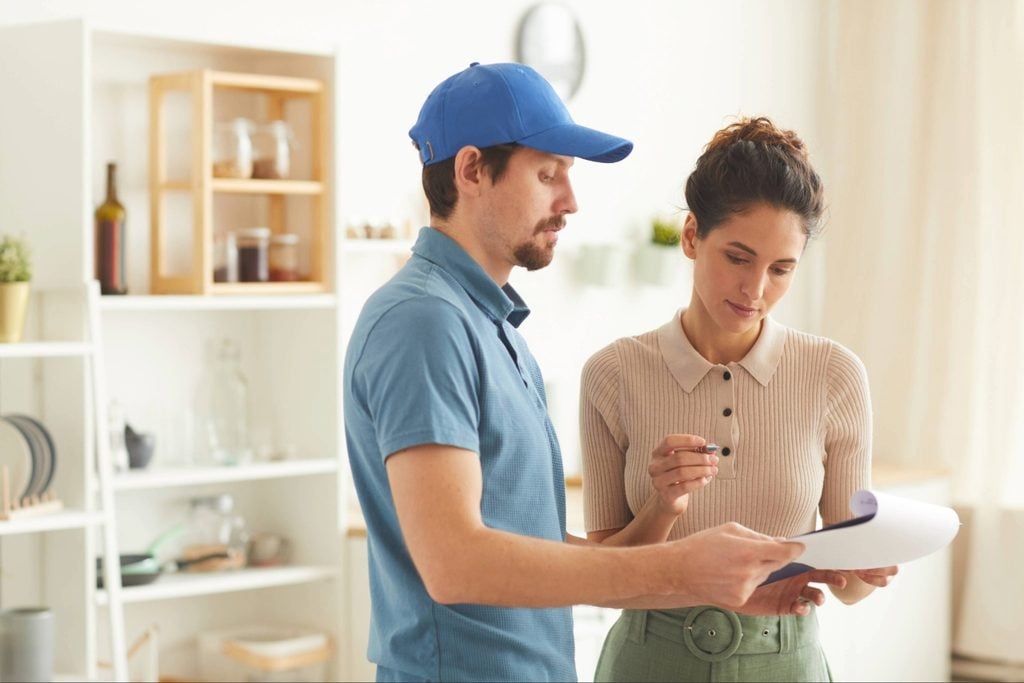 Termite inspection when buying a home in Port Charlotte with inspector explaining findings to buyers