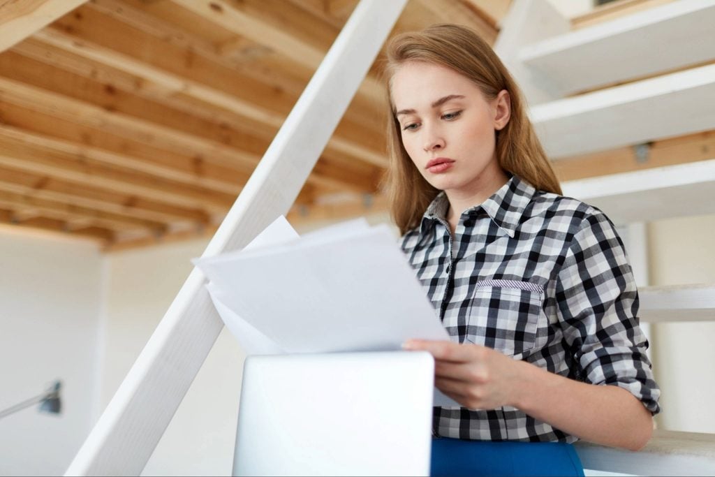 Termite inspection when buying a home in Port Charlotte with buyer reviewing property records